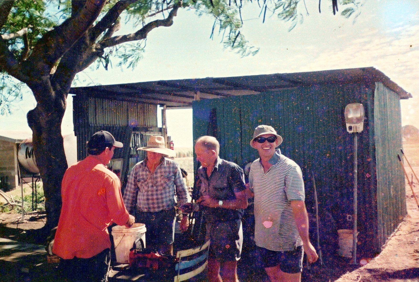 Volunteers gather at the old course maintenance shed.