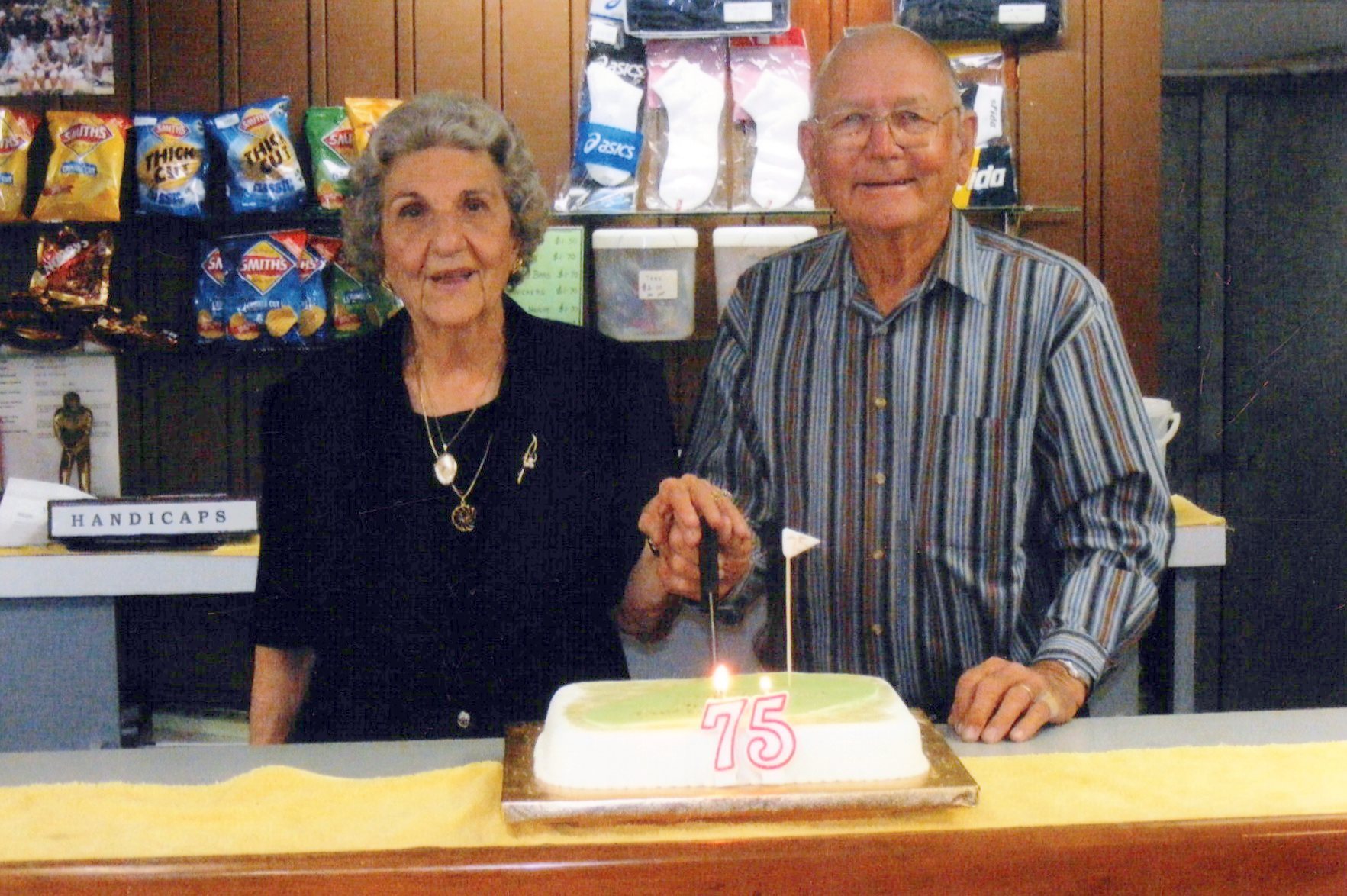 Cutting the cake at the club's 75th anniversary celebrations.